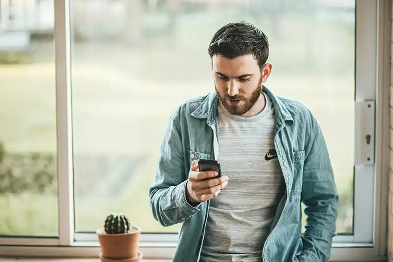 guy watching his phone